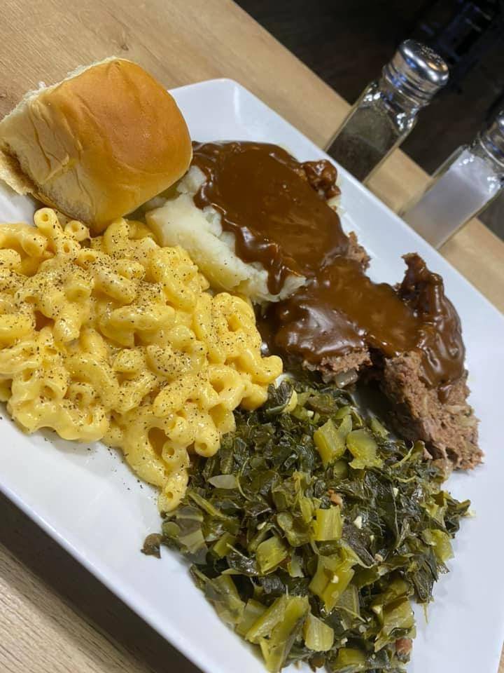 Soul food plate with mac and cheese, greens and mashed potatoes