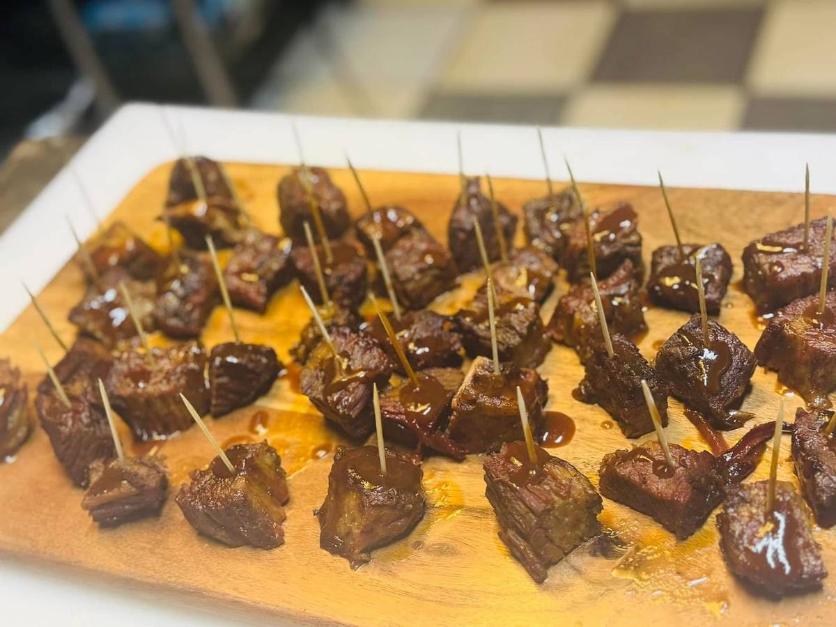 Steak bites on a wooden board