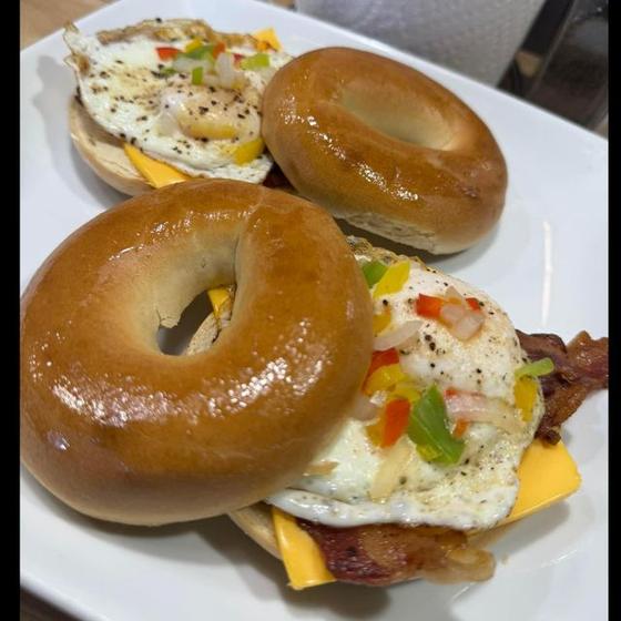 Breakfast bagel sandwich with eggs