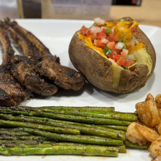 Lamb chops, loaded baked potato and asparagus