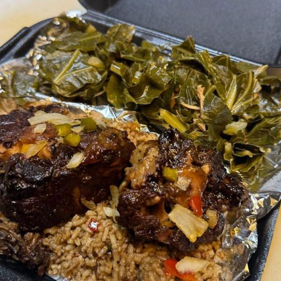 Oxtails over rice with greens