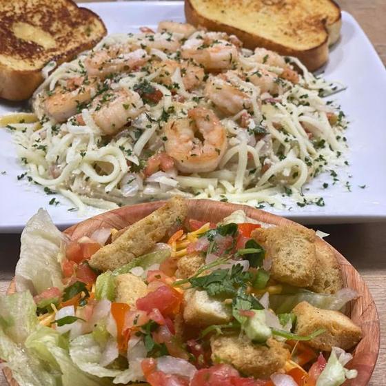 Shrimp fettuccine with salad and garlic bread